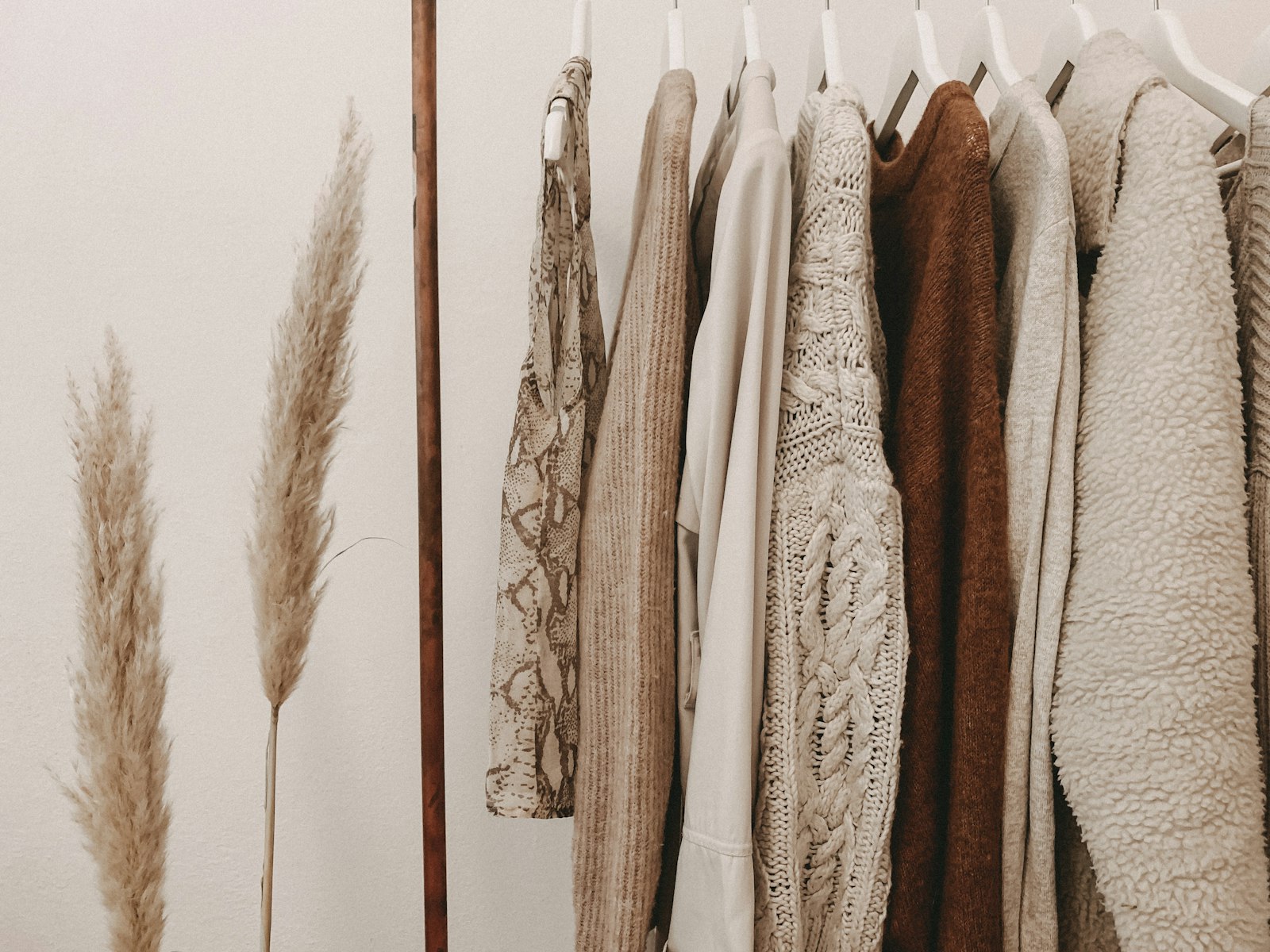 Neutral linen garments hanging in soft light